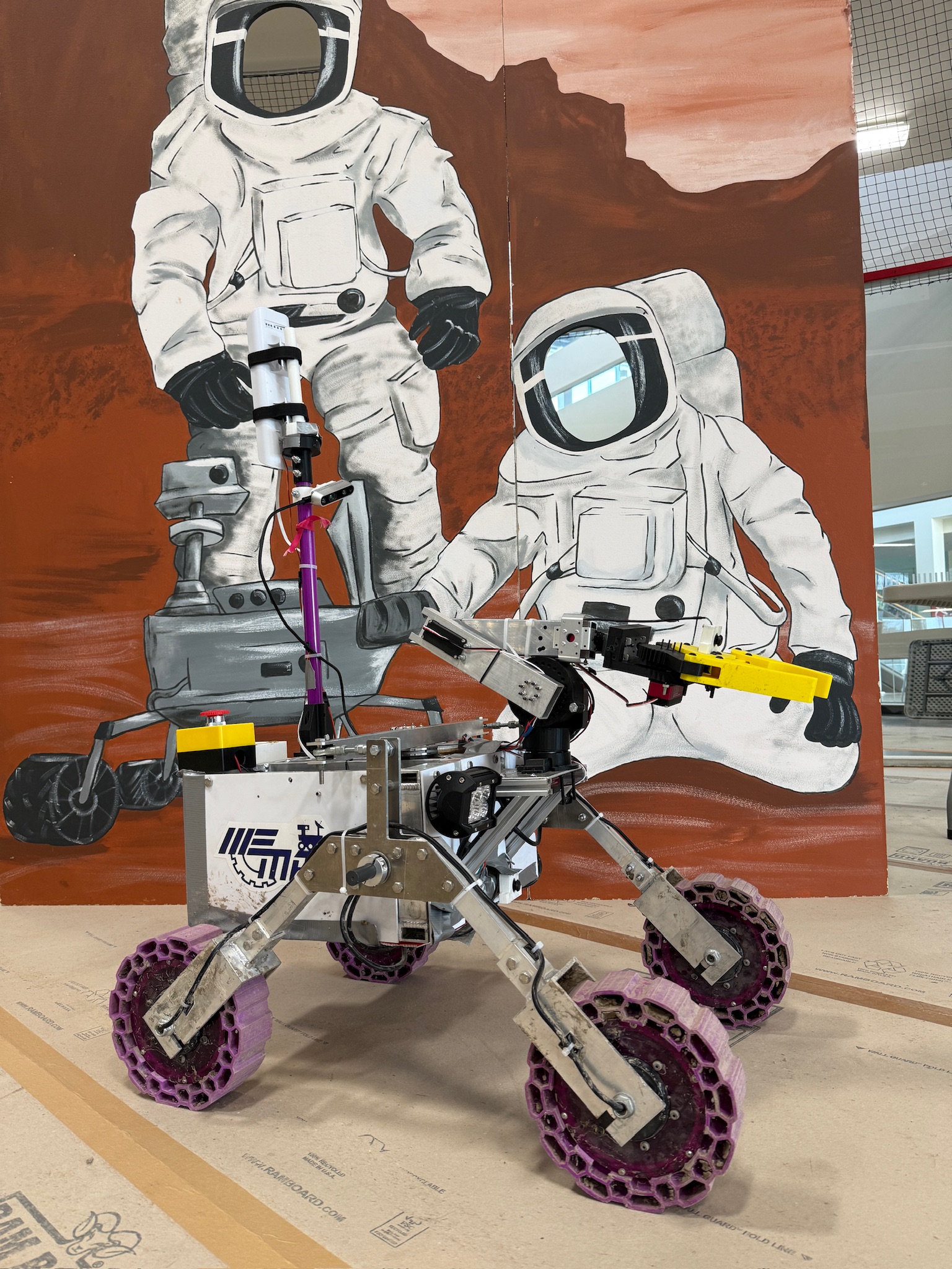 Rover in front of competition board